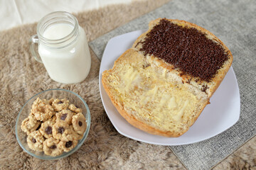 Bread with chocolate choco rice and butter with milk and snack for breakfast