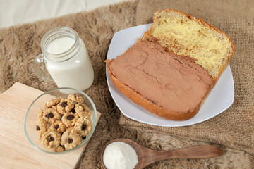 Bread with choco powder and butter on a plate for breakfast