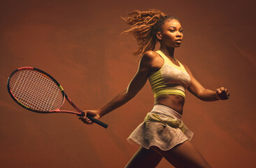 Female tennis player holding a racket in movement on brown background. Created with Generative AI technology