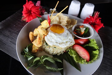 indonesian food,fried rice with sunny side egg and chicken satai