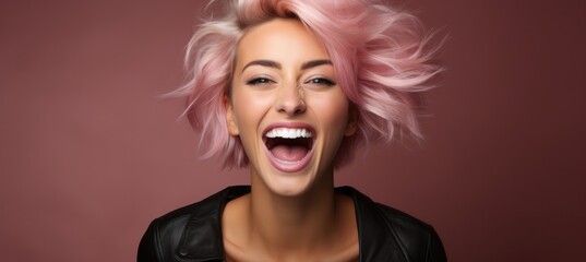Smiling woman with opened mouth on pink background 