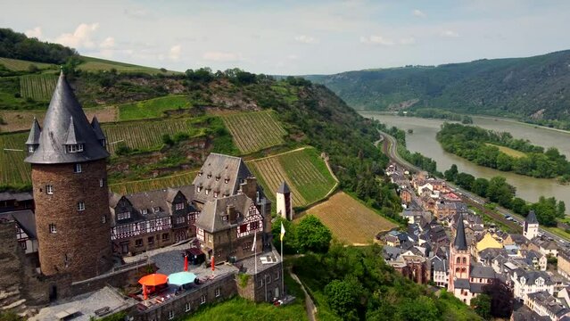 Burg Stahleck Medieval Castle and hilltop Hostel overlooking middle Rhine valley and german Bacharach town. Aerial