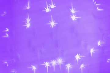 Fototapeta na wymiar Bokeh as lights white stars on lilac color background, abstract winter holiday wallpaper with blurred pattern. Christmas or New Year abstract image as backdrop, aesthetic blur background