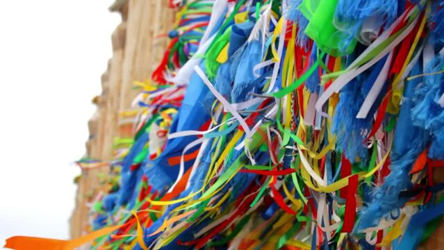 Baikal Lake. Video of sacred place on Cape Burkhan with Serge wooden pillars on Olkhon Island; Buryat colorful scarves - khodaks are tied to them, asking spirits for help and health. Tourists landmark