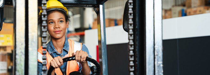Portrait of a female worker with a forklift in the warehouse., Industrial and industrial concept.