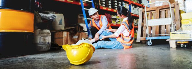 A female warehouse worker has an accident while working in a factory. © NewSaetiew