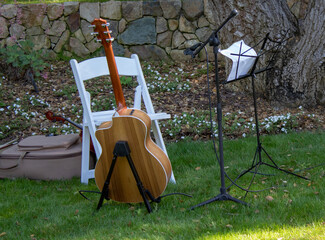 Area set up for guitarist to play during outdoor wedding ceremony.