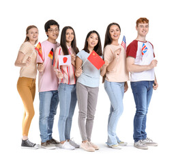 Obraz premium Young students of language school with flags on white background