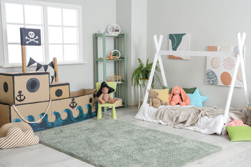 Pirate cardboard ship in interior of children's bedroom