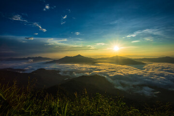 beautiful scenery Natural landscape, morning light and fog in a high mountain valley. Doi Pha Tang view point Chiang Rai Province of Thailand
