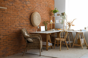 Interior of office with modern workplace and houseplants