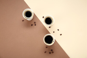 Takeaway paper cups of tasty coffee on color background