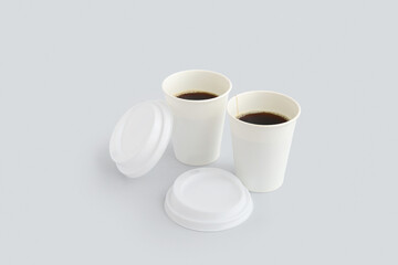 Takeaway paper cups of tasty coffee on white background