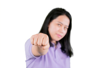 Portrait of a fat woman in sports wear hitting at camera