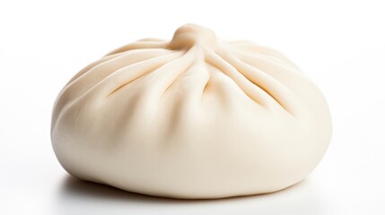 Single steamed bao bun isolated on white background.