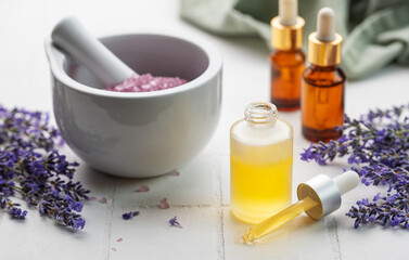 Fototapeta na wymiar Lavender salt, natural essential oil and fresh lavender
