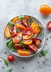 Green salad from leaves and tomatoes