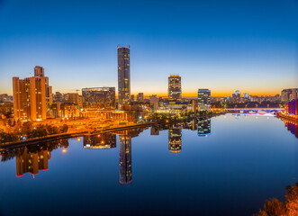 Yekaterinburg city and pond aerial panoramic view at summer or early autumn night. Night city in the early autumn or summer.