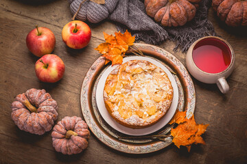 Apple pie with almonds and cup of herbal fruit tea for Thanksgiving