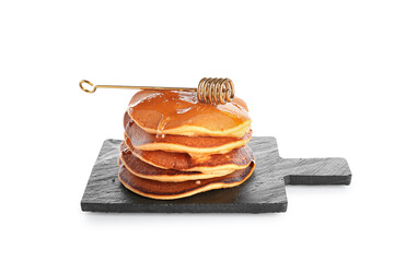 Black board of tasty pumpkin pancakes with honey on white background