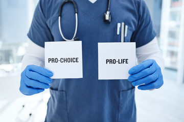 Closeup, doctor and abortion with option, card and healthcare in a hospital, policy and law. Zoom,...