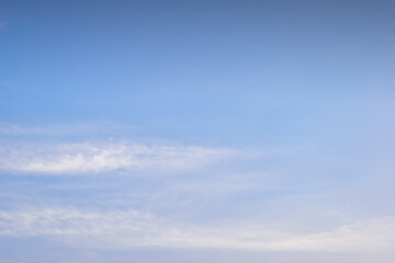 beautiful blue sky and white fluffy cloud with sunrise in the morning, natural background