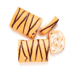 Pieces of sweet sponge cake roll on white background