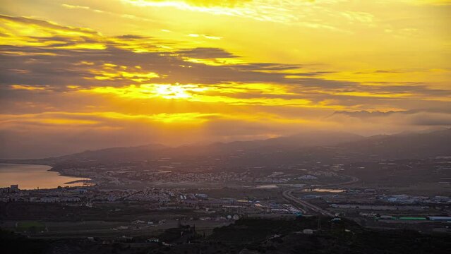 A Time Lapse Shot Of A Sunset Cloud And A Cityscape Near The Coast In Spain
