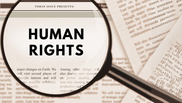 Selective Focus Photography of Human Rights Text Publication in Newspaper