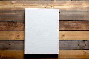 mock up of blank white book on wooden boards background