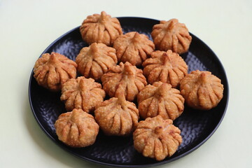 Modak- a traditional dish made during Ganpati festival in India, a sweet made with coconut, jaggery, and dry fruits stuffed inside the wheat dough
