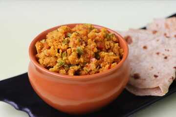 Shimla Mirch Zunka, Besan Capsicum Sabzi, a spicy Maharashtrian dish, served with bhakri or chapati