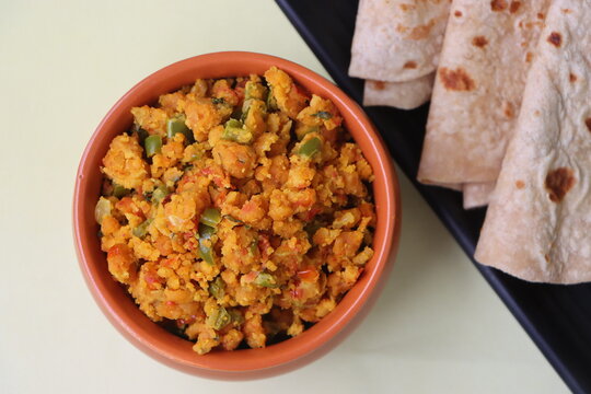 Shimla Mirch Zunka, Besan Capsicum Sabzi, a spicy Maharashtrian dish, served with bhakri or chapati