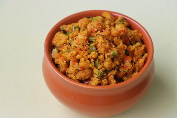 Shimla Mirch Zunka, Besan Capsicum Sabzi, a spicy Maharashtrian dish, served with bhakri or chapati