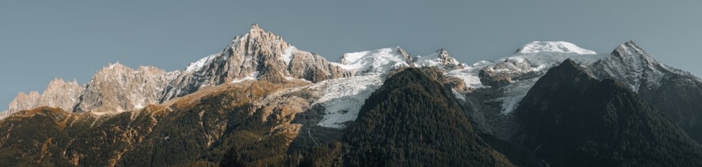 Mountain panorama of the Chamonix Alps, Haute-Savoie, France. Aiguille du Midi and the Mont Blanc Massif as seen from Chamonix-Mont-Blanc.