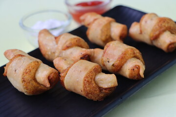 Potato roll samosa, spiral potato samosa, starter or appetizer, served with tomato ketchup and mayonnaise