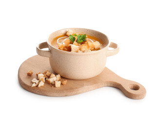 Pot of delicious pumpkin cream soup with parsley and croutons on white background