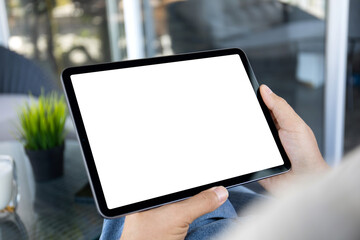 Male hands holding computer tablet with isolated screen in office