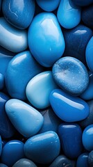 Macro photography of blue pebbles of different shapes.