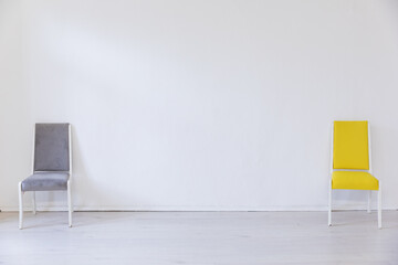 Two chairs in the interior of an empty room