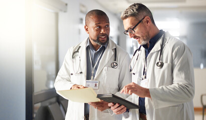 Teamwork, tablet or mature doctors talking for advice in healthcare discussion for file documents....
