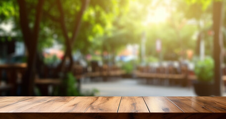 Wooden table with bright blurred background of outdoor cafe