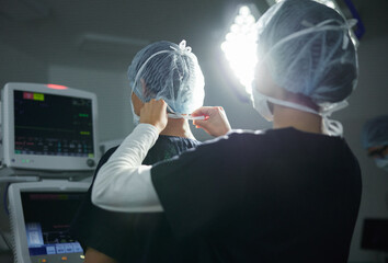 Getting ready, healthcare and doctors in a surgery theater for medical procedure or treatment....
