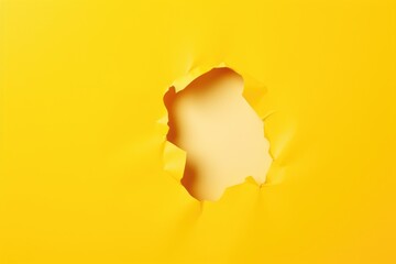 paper hole with torn sides on yellow background - obrazy, fototapety, plakaty