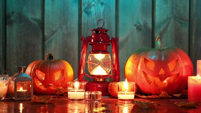 halloween pumpkin head jack lantern on wooden background. dramatic lighting.