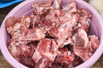 Fresh pork bones in a basin