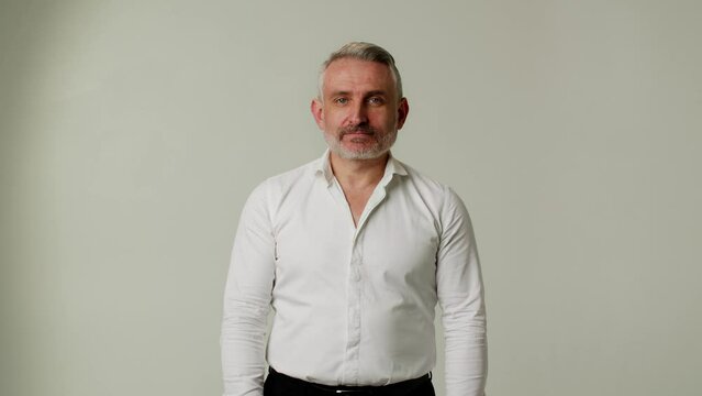 A middle aged man expresses doubts about the correctness of someone else advice. A businessman or boss questions the hasty conclusions of partner or subordinate. The demonstration of gesture of a