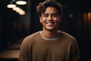 Fototapeta premium portrait of a handsome man smiling with mock up shirt and studio background