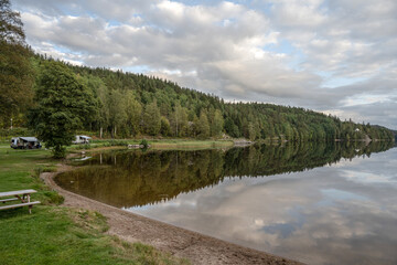 Fototapeta na wymiar Lake Ragnerudssjoen mirror in Dalsland Sweden beautiful nature forest pinetree swedish