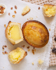 Pasticciotto leccese pastry filled with egg custard cream on a napkin top view